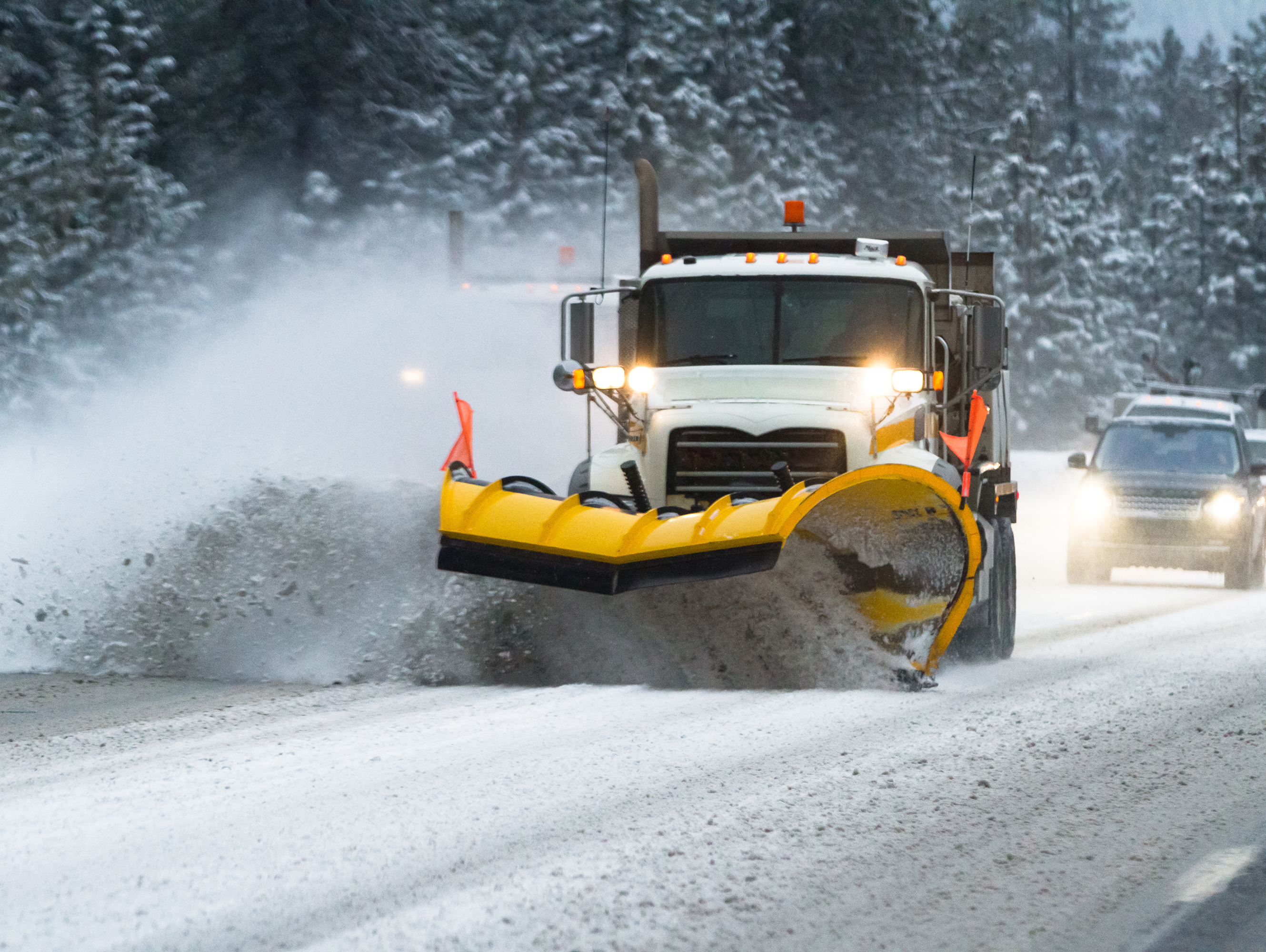 Vehicles Behind Snow Plow