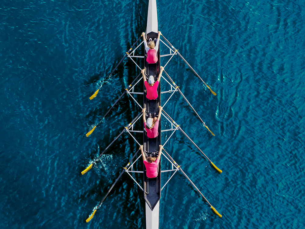 Aerial view of rowing team on water